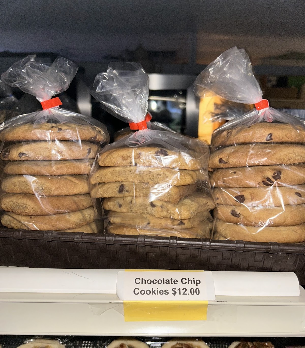 Bags of fresh homemade chocolate chip cookies on the bakery shelf