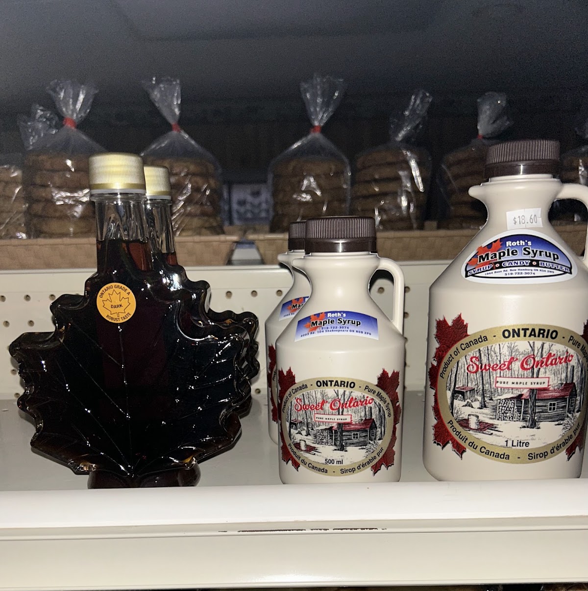 Ontario maple syrup in a leaf-shaped bottle and ceramic jugs